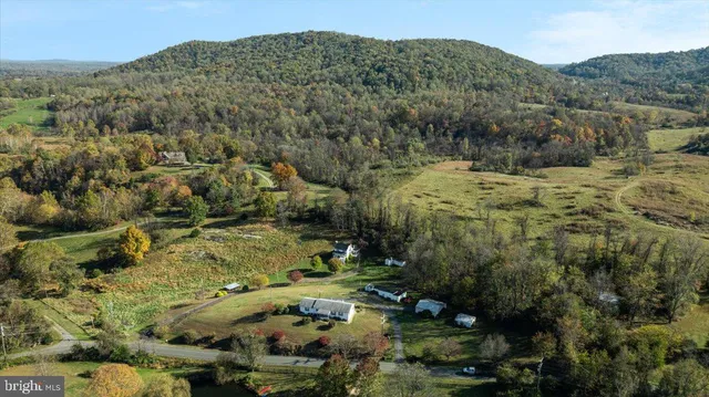 a view of a city with green field