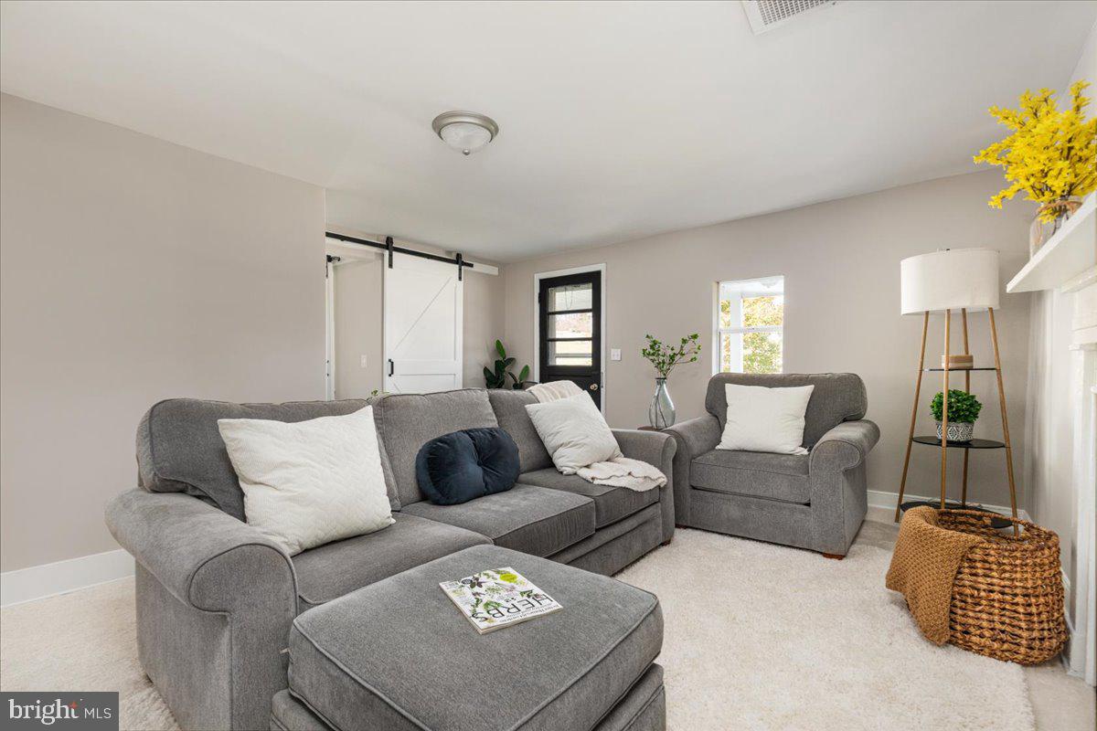 13886 Crest Hill Road Flint Hill, VA 22627 - Photo 5 of 45 a living room with furniture and a couch