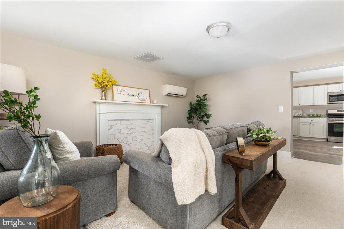 13886 Crest Hill Road Flint Hill, VA 22627 - Photo 6 of 45 a living room with furniture and a potted plant