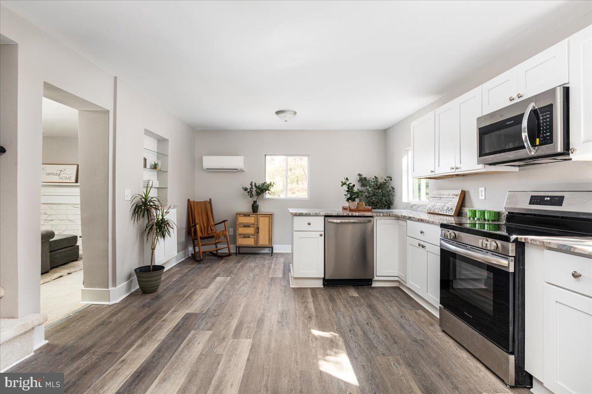 13886 Crest Hill Road Flint Hill, VA 22627 - Photo 7 of 45 a kitchen with sink a microwave and cabinets