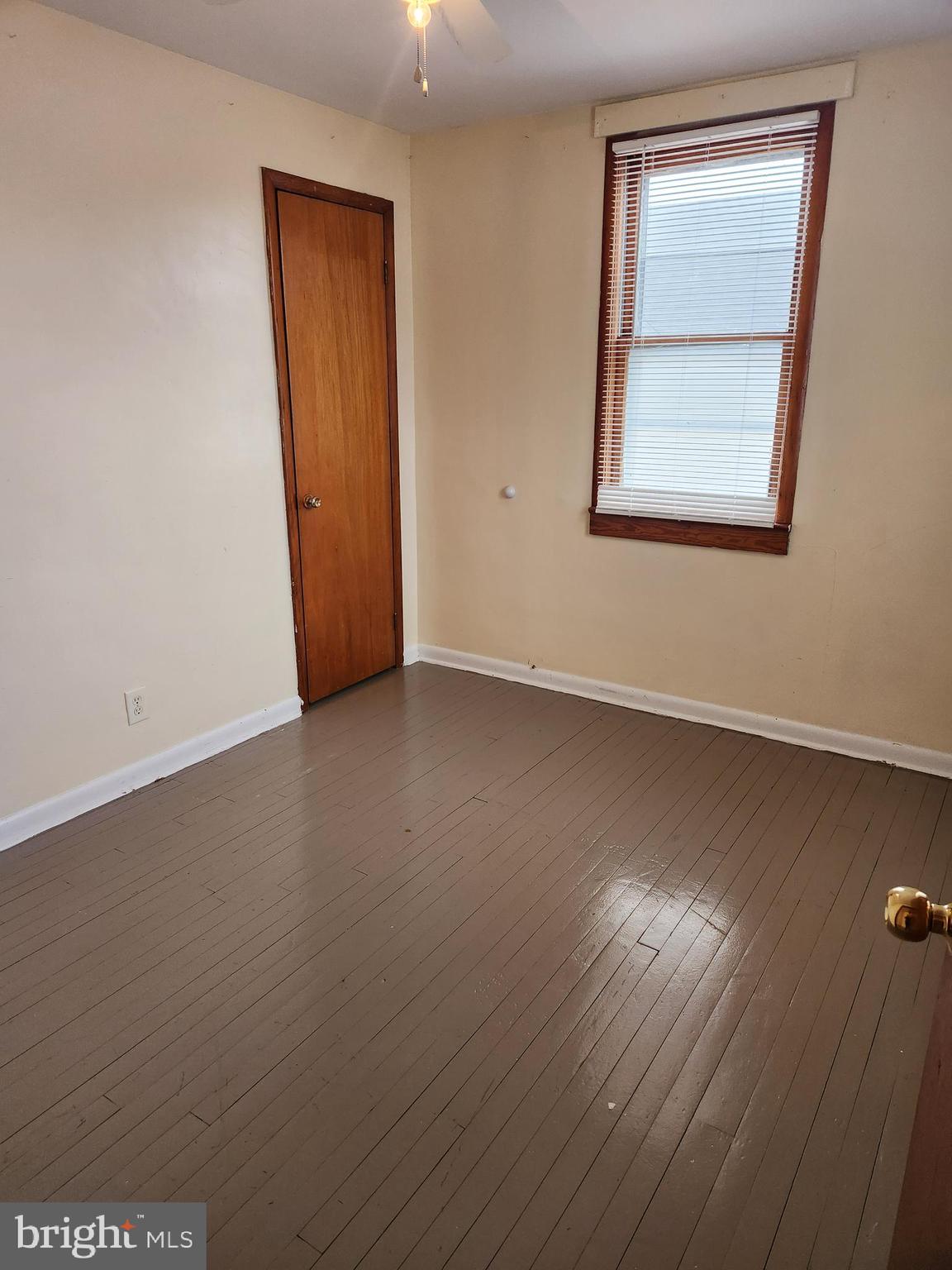 59 Gilmore Street Keyser, WV 26726 - Photo 11 of 13 an empty room with wooden floor and windows