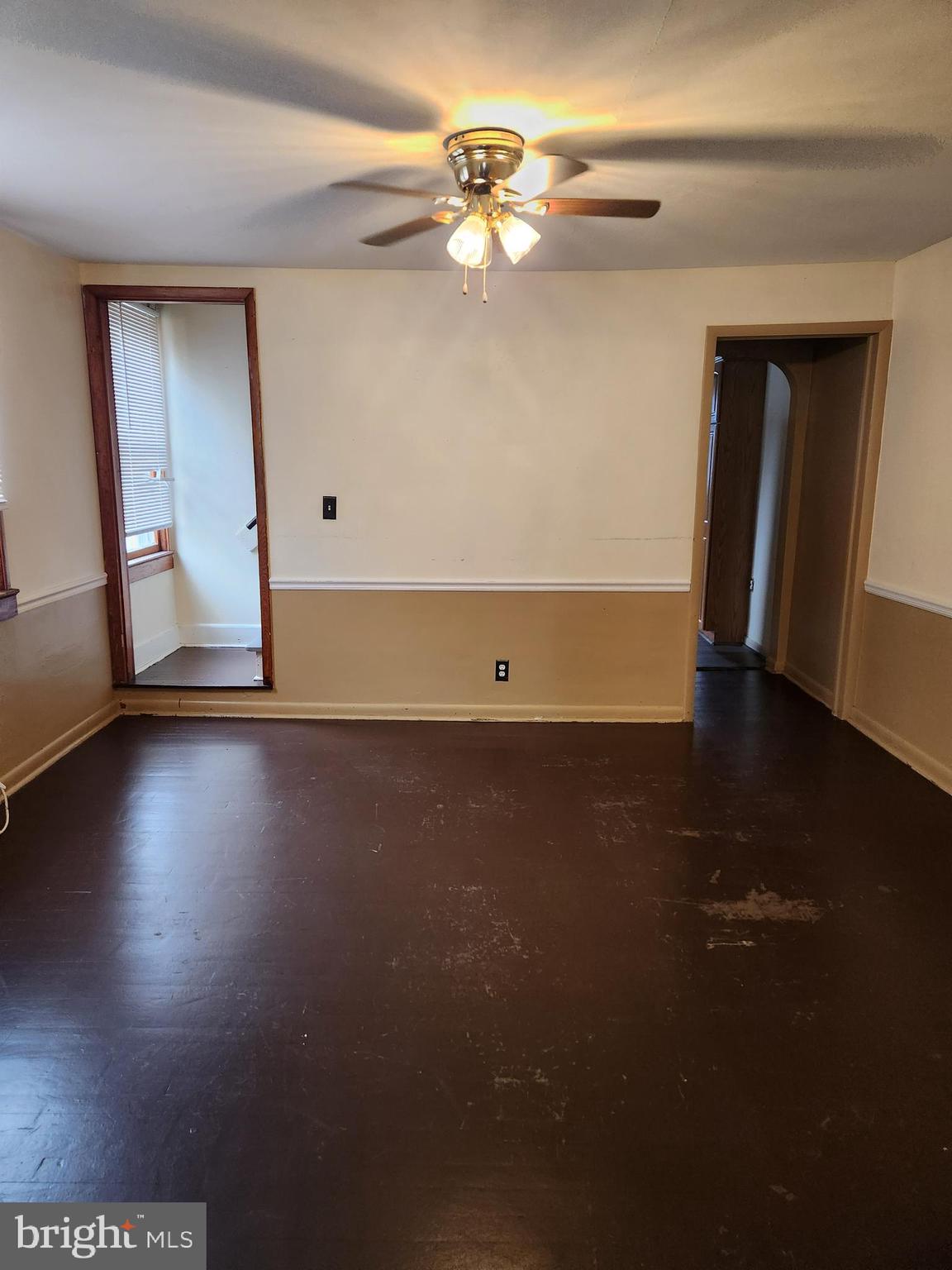 59 Gilmore Street Keyser, WV 26726 - Photo 3 of 13 a view of room with hardwood floor and ceiling fan