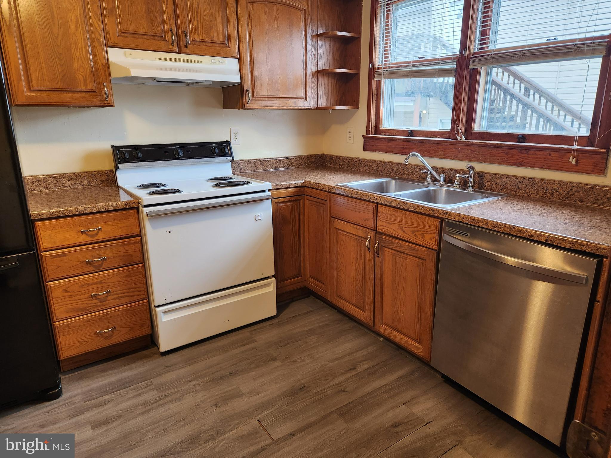 59 Gilmore Street Keyser, WV 26726 - Photo 4 of 13 a kitchen with granite countertop cabinets stainless steel appliances and a sink