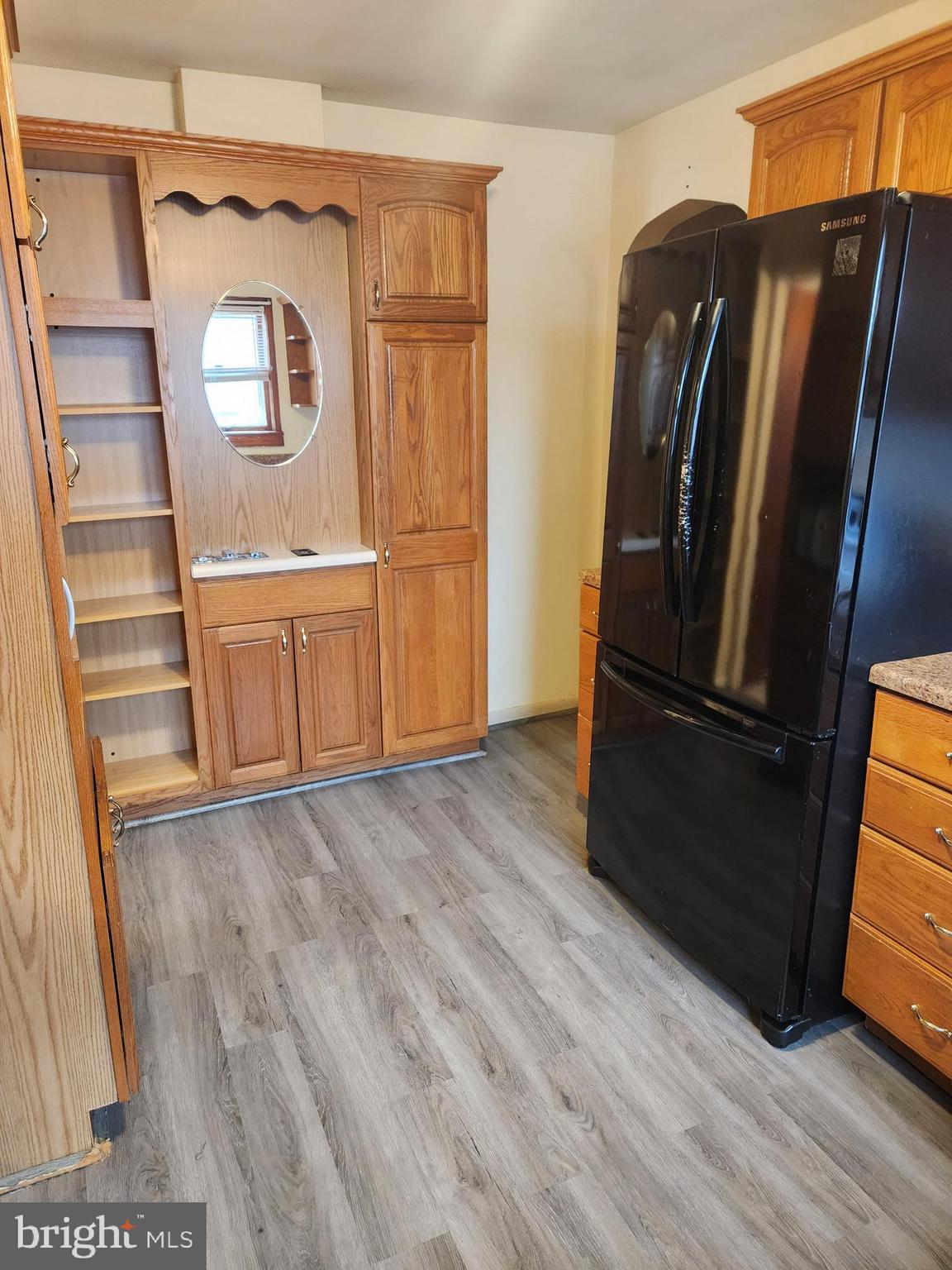 59 Gilmore Street Keyser, WV 26726 - Photo 5 of 13 a view of a refrigerator in kitchen and an empty room