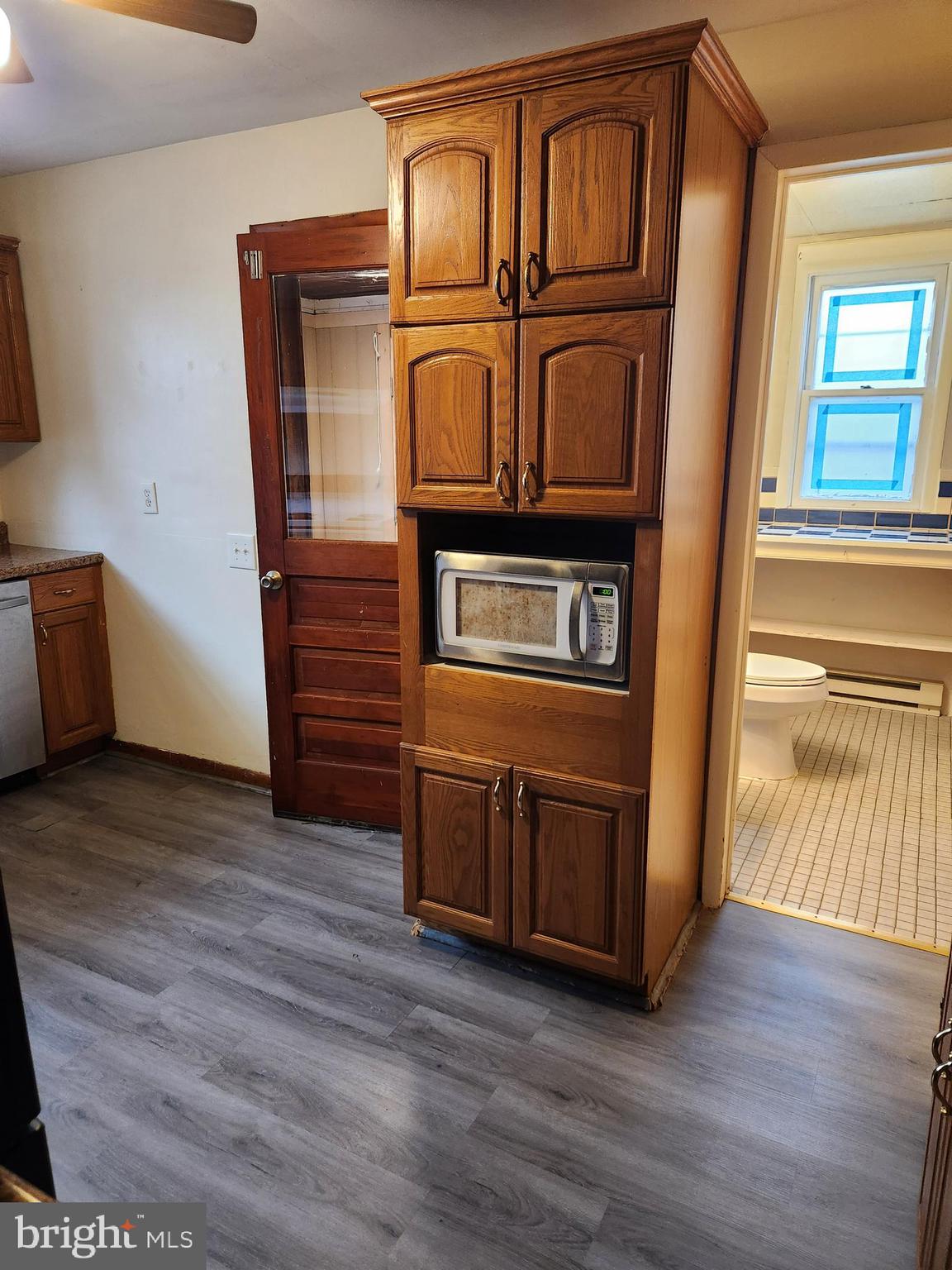 59 Gilmore Street Keyser, WV 26726 - Photo 6 of 13 a view of a refrigerator in kitchen and wooden floor