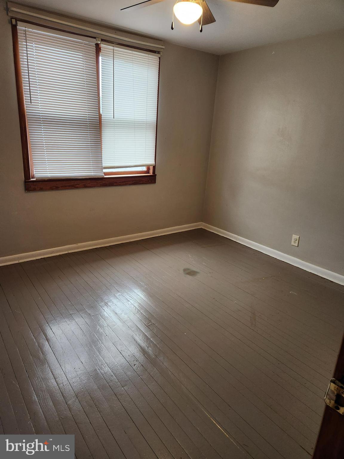 59 Gilmore Street Keyser, WV 26726 - Photo 10 of 13 an empty room with wooden floor and windows