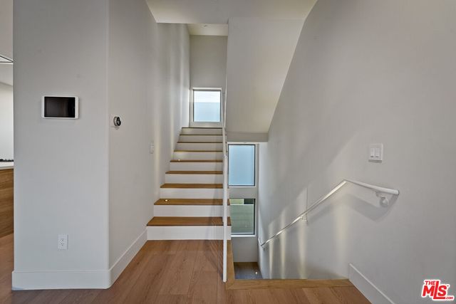 a bedroom with a bed and cabinets