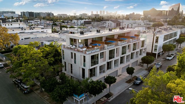 a view of swimming pool yard from a patio