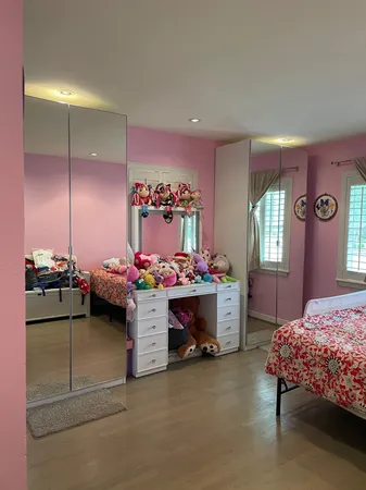 a bedroom with furniture and a window