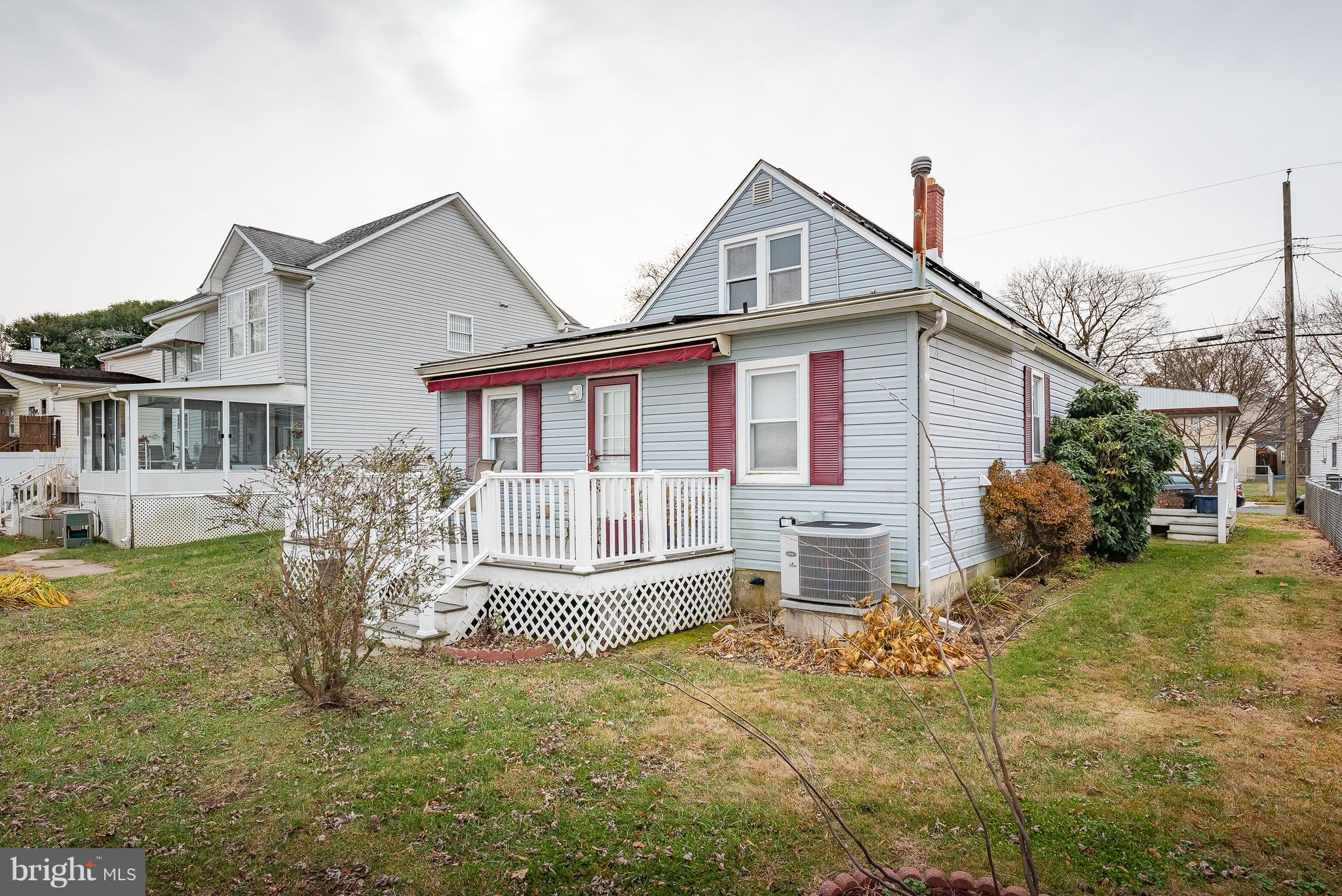 8238 Northview Road Baltimore, MD 21222 - Photo 2 of 42 a front view of a house with a garden and porch
