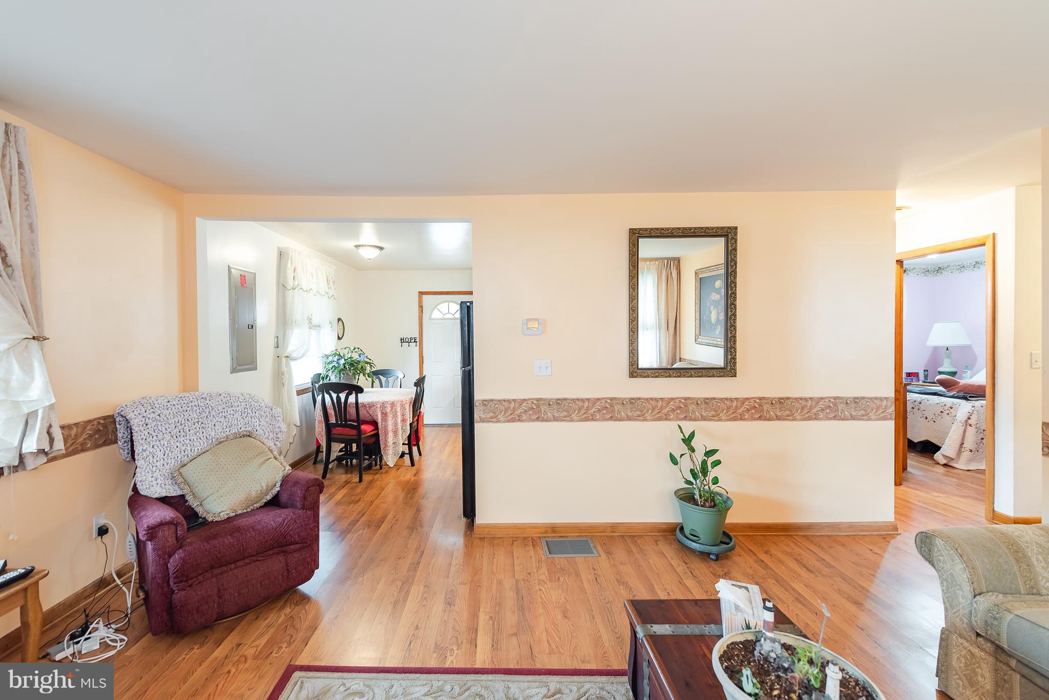 8238 Northview Road Baltimore, MD 21222 - Photo 19 of 42 a living room with furniture and wooden floor