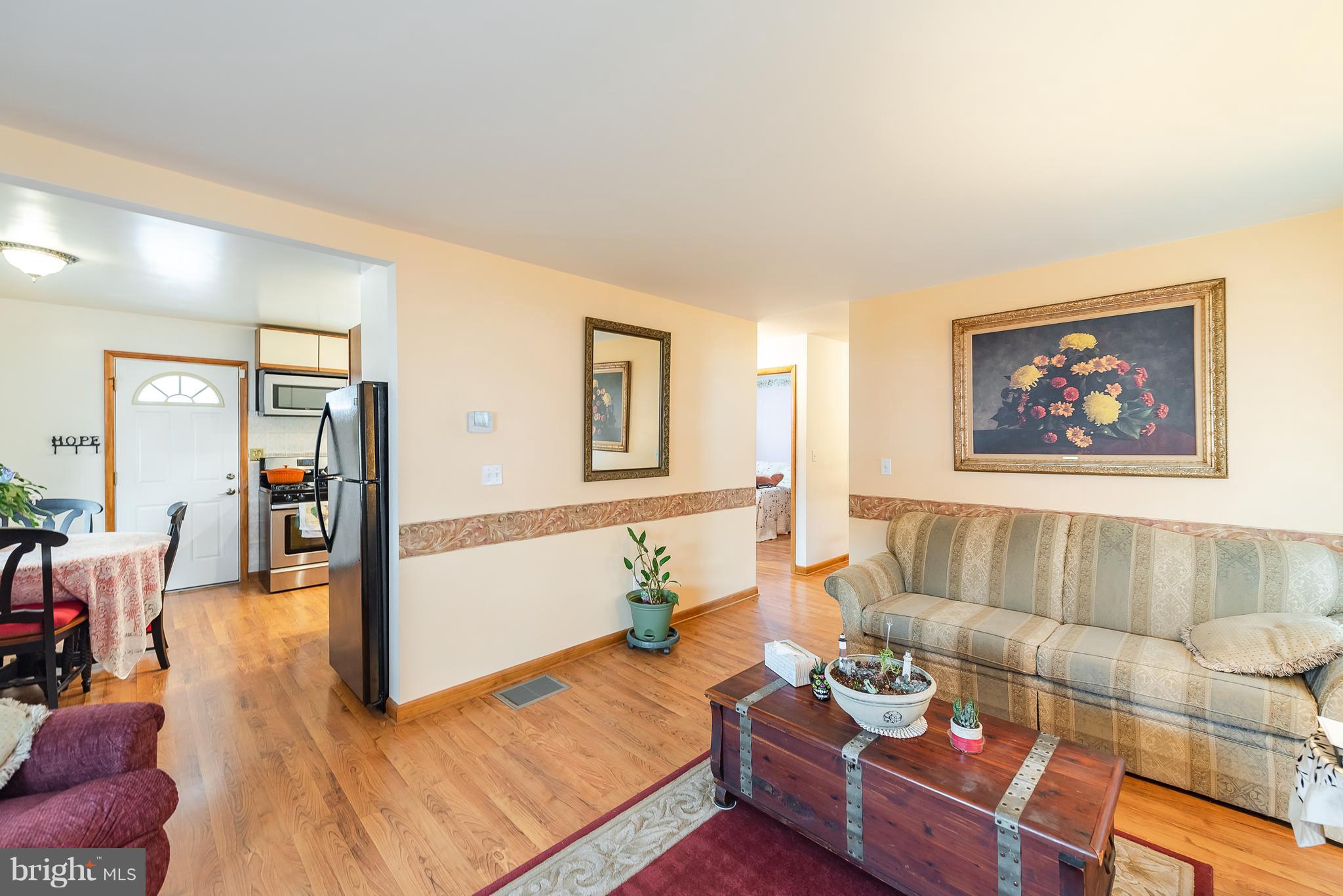8238 Northview Road Baltimore, MD 21222 - Photo 20 of 42 a living room with furniture and wooden floor