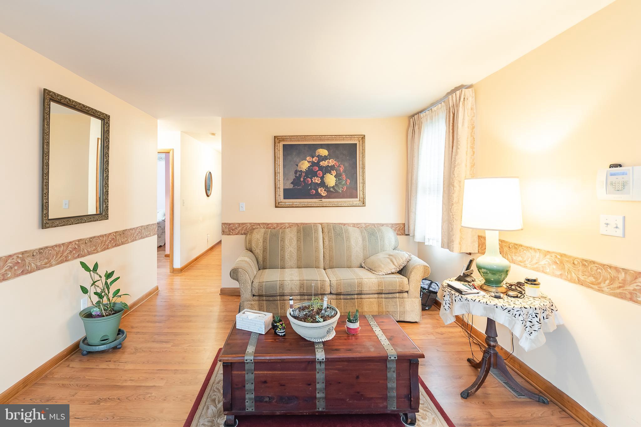 8238 Northview Road Baltimore, MD 21222 - Photo 21 of 42 a living room with furniture and a large window