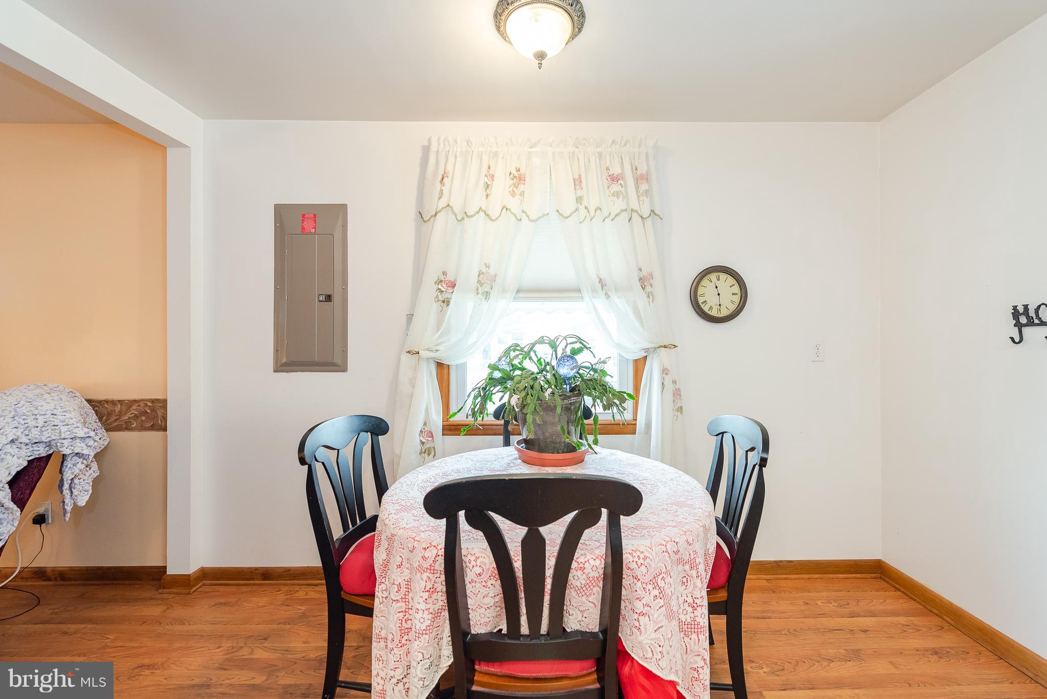8238 Northview Road Baltimore, MD 21222 - Photo 23 of 42 a view of a dining room with furniture and wooden floor