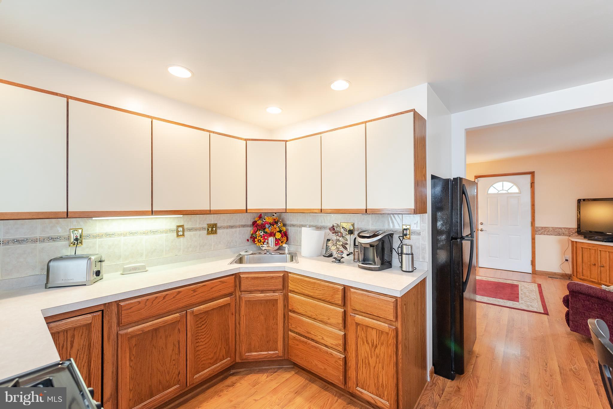 8238 Northview Road Baltimore, MD 21222 - Photo 25 of 42 a kitchen with sink cabinets and refrigerator