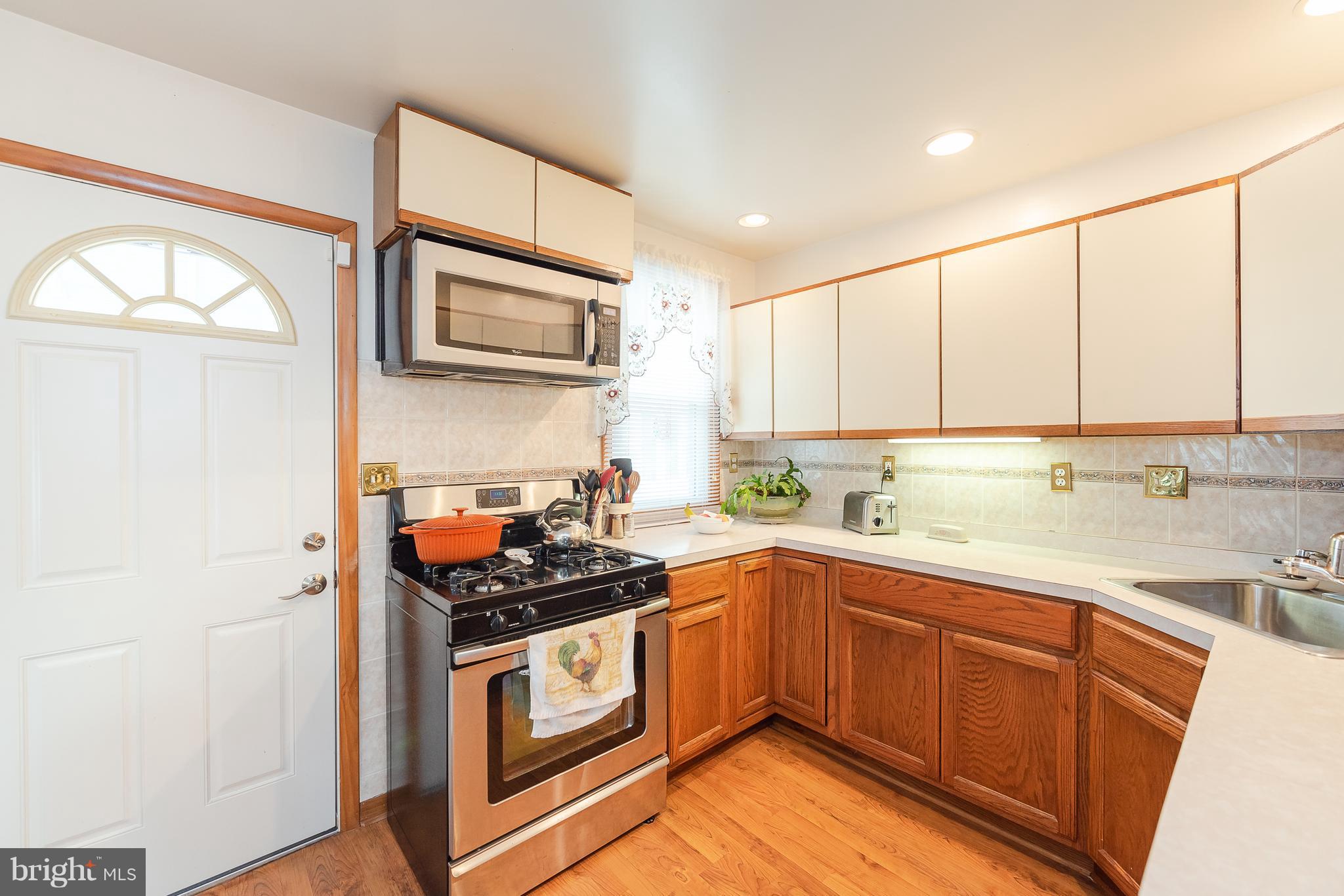 8238 Northview Road Baltimore, MD 21222 - Photo 26 of 42 a kitchen with stainless steel appliances granite countertop a stove sink and cabinets