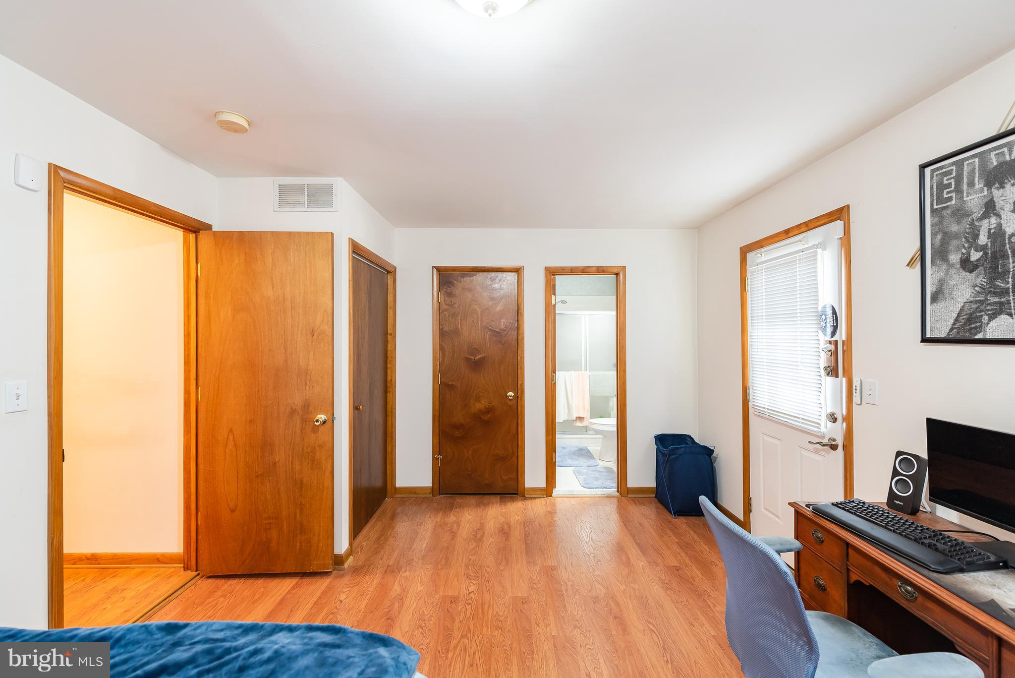 8238 Northview Road Baltimore, MD 21222 - Photo 35 of 42 a view of an empty room with wooden floor and a window