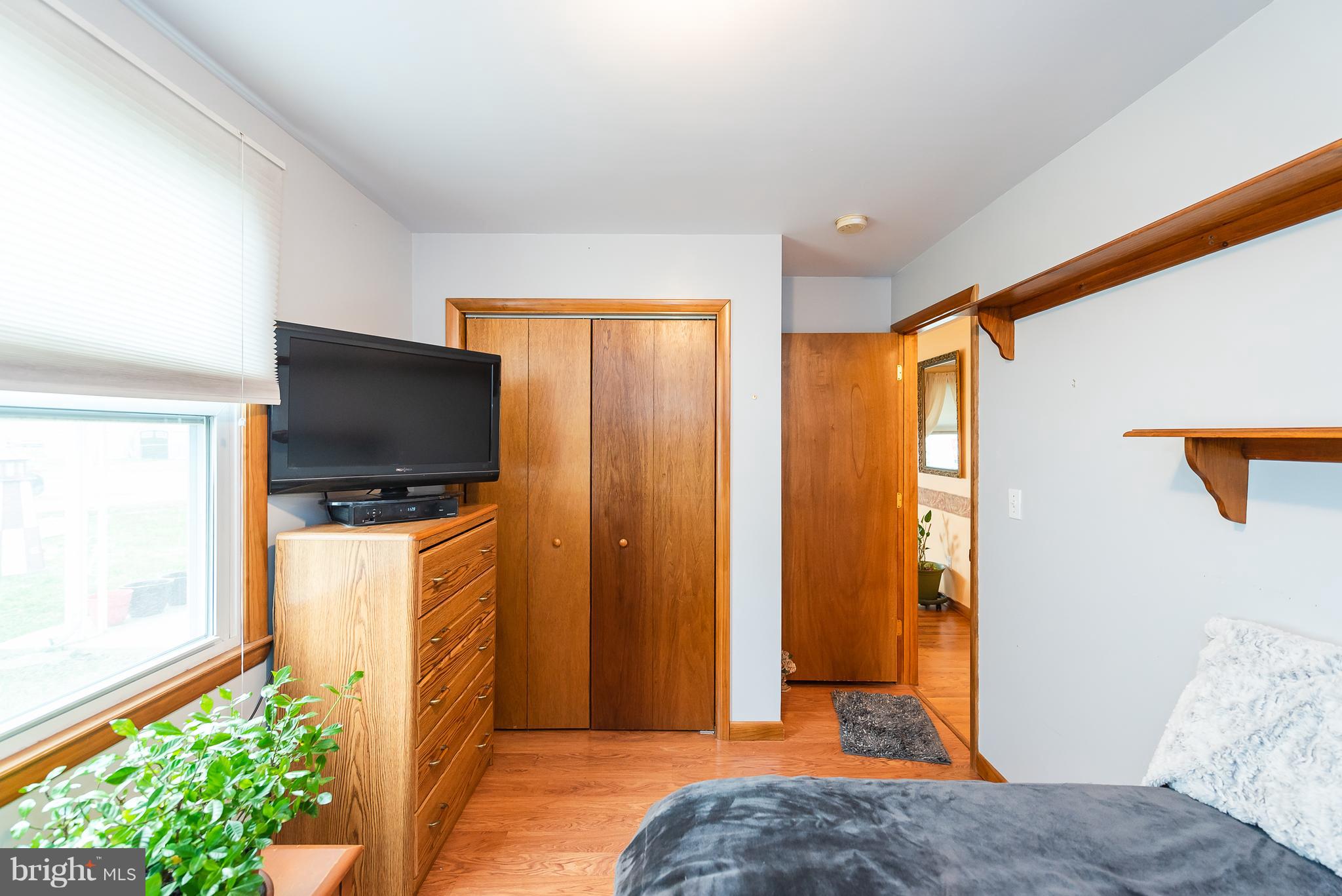 8238 Northview Road Baltimore, MD 21222 - Photo 39 of 42 a bedroom with a bed and a flat screen tv