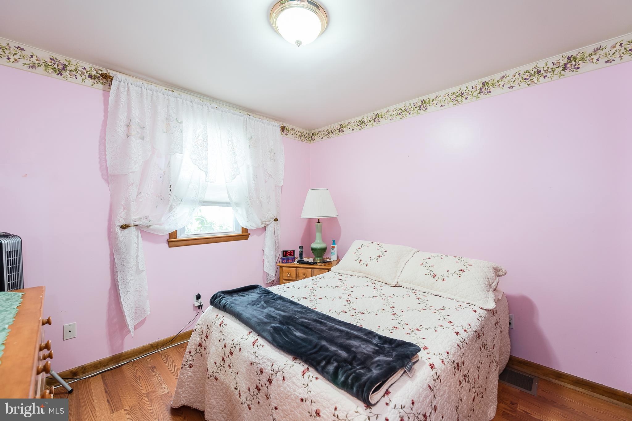 8238 Northview Road Baltimore, MD 21222 - Photo 40 of 42 a bedroom with a bed and a window