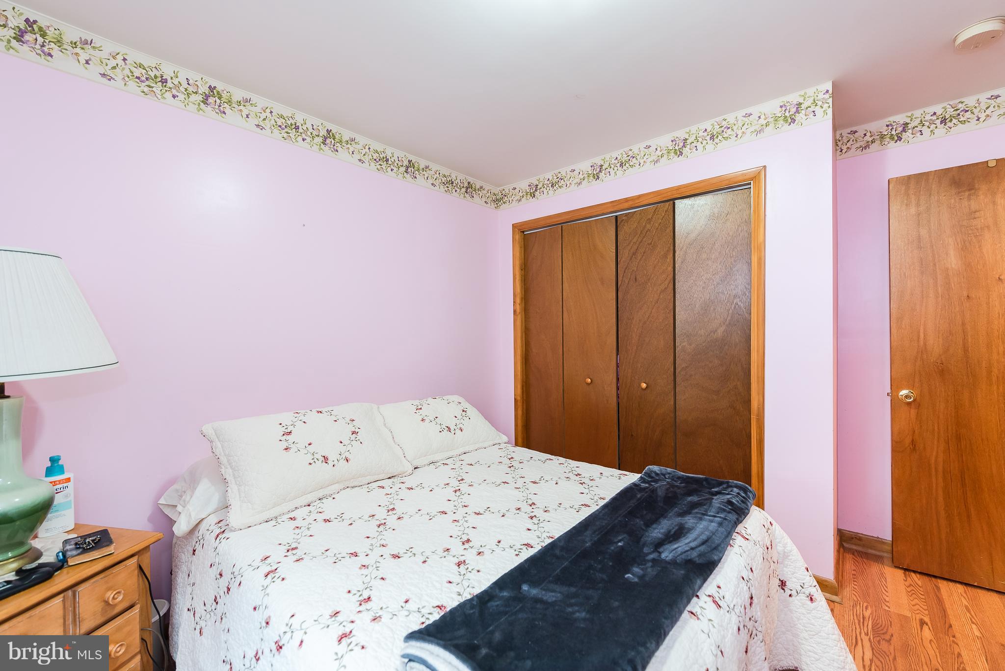 8238 Northview Road Baltimore, MD 21222 - Photo 42 of 42 a bedroom with a bed and a dresser