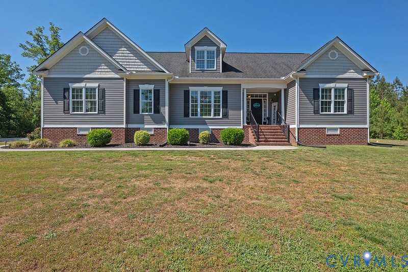 9425 Marie Road New Kent, VA 23124 - Photo 2 of 55 a front view of a house with a yard