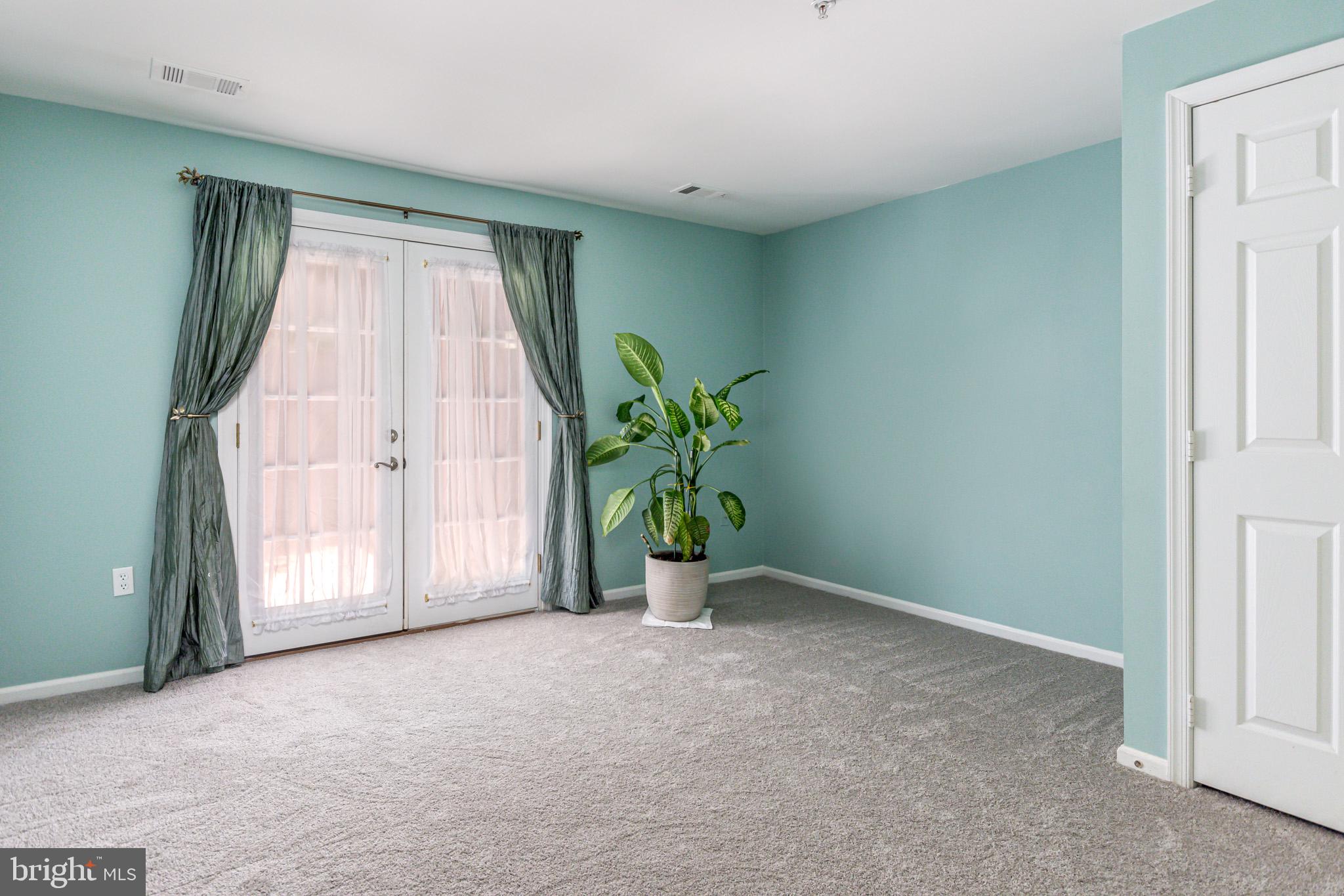 210 Sycamore Ridge Road Laurel, MD 20724 - Photo 27 of 40 Lowerl level bedroom with patio access