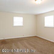 10437 Rutgers Road Jacksonville, FL 32218 - Photo 3 of 11 an empty room with a window