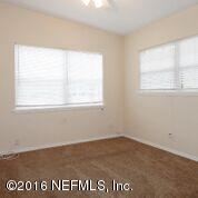 10437 Rutgers Road Jacksonville, FL 32218 - Photo 6 of 11 an view of an empty room with a window