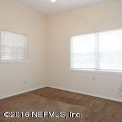 10437 Rutgers Road Jacksonville, FL 32218 - Photo 7 of 11 a view of an empty room with a window
