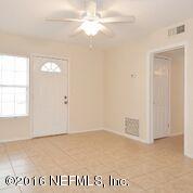 10437 Rutgers Road Jacksonville, FL 32218 - Photo 9 of 11 an empty room with windows and closet