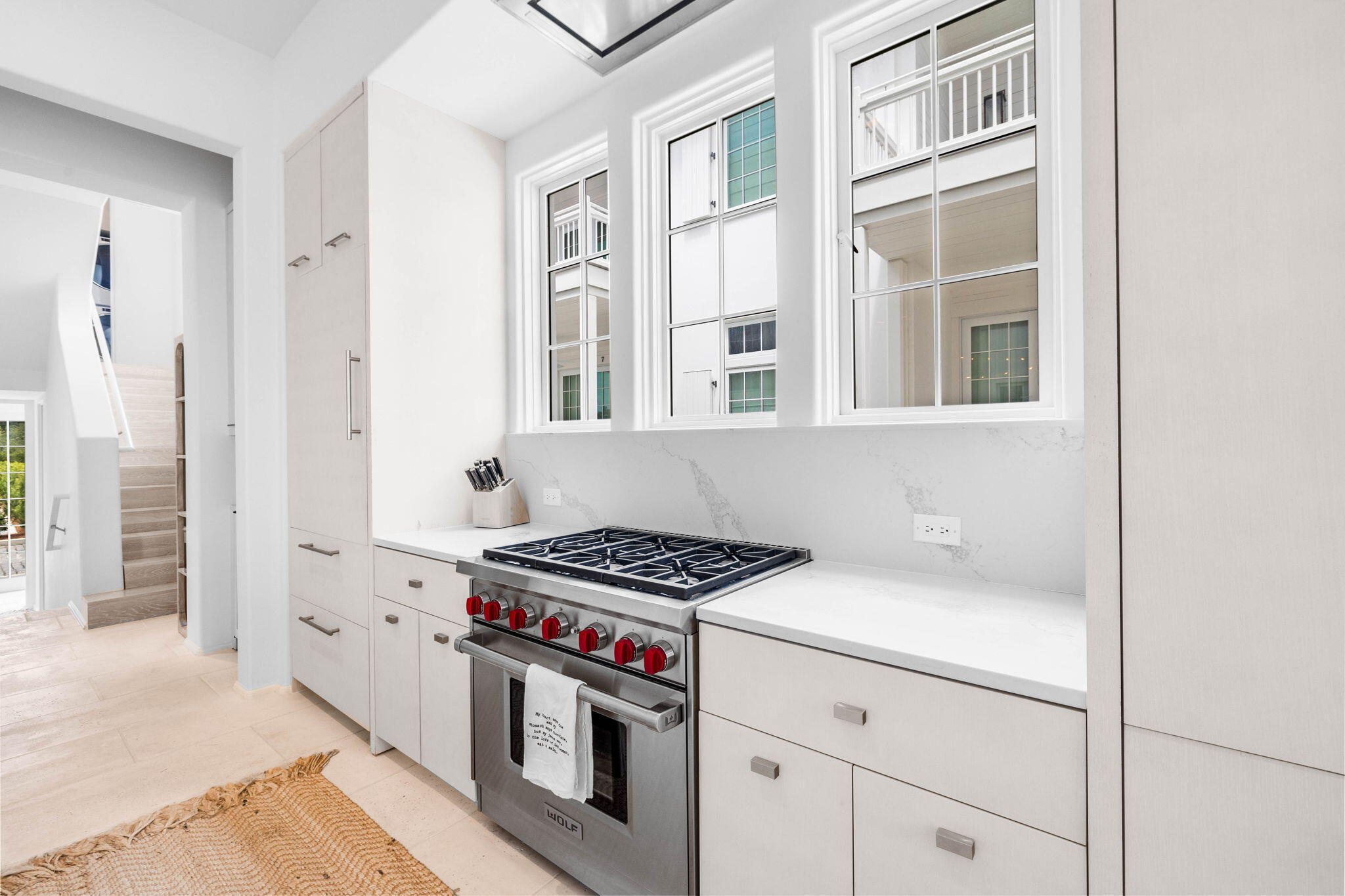 161 Catnap Alley Inlet Beach, Unit M6 Inlet Beach, FL 32461 - Photo 19 of 88 a kitchen with cabinets and a stove top oven