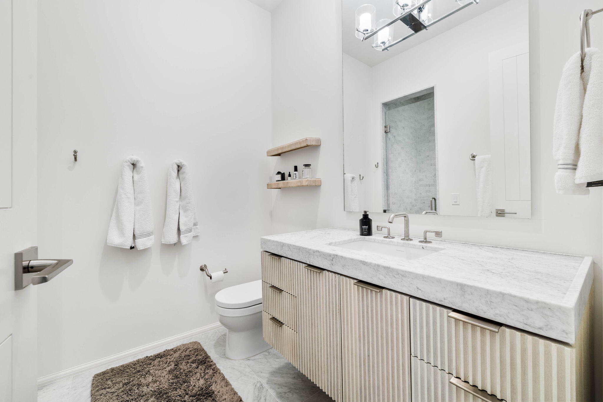 161 Catnap Alley Inlet Beach, Unit M6 Inlet Beach, FL 32461 - Photo 40 of 88 a bathroom with a granite countertop sink a toilet and a large mirror