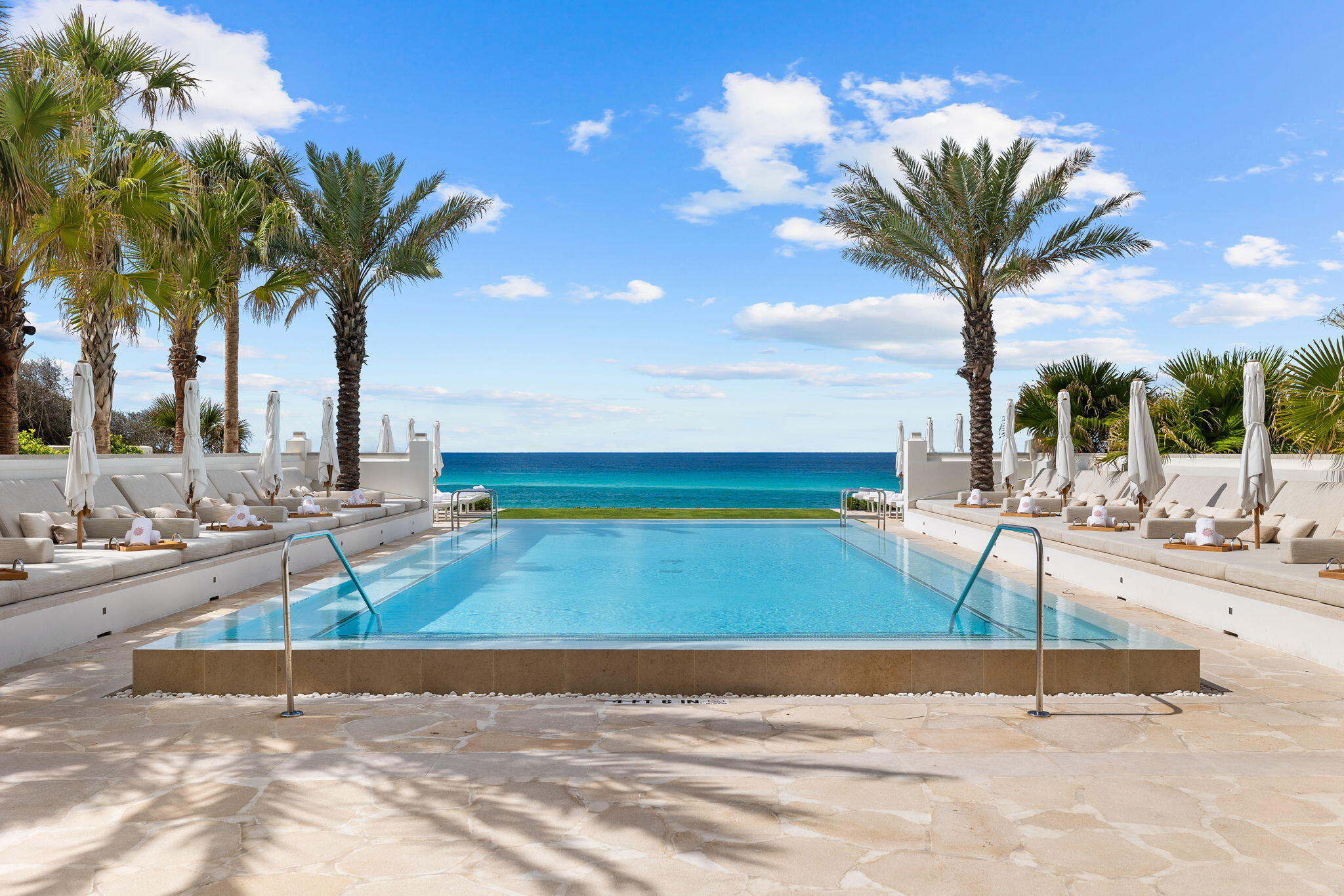 161 Catnap Alley Inlet Beach, Unit M6 Inlet Beach, FL 32461 - Photo 88 of 88 a view of a swimming pool with a yard and palm trees