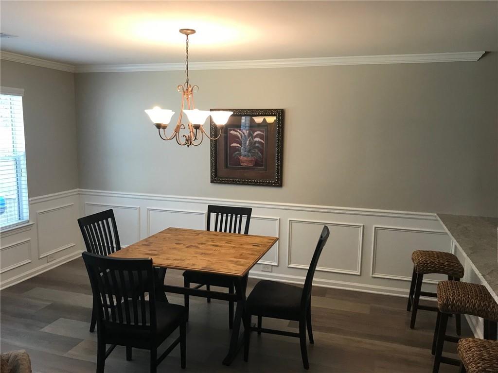 322 Hidden Creek Lane Canton, GA 30114 - Photo 14 of 44 a view of a dining room with furniture and window