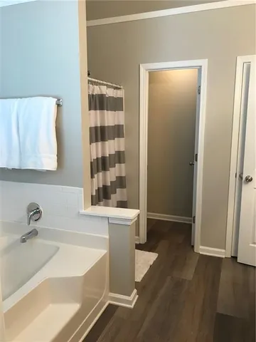 a bathroom with a bathtub and a sink