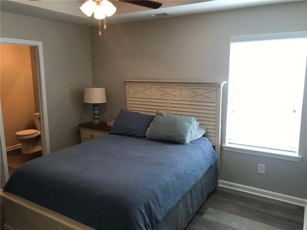 322 Hidden Creek Lane Canton, GA 30114 - Photo 26 of 44 a bedroom with a bed and a window