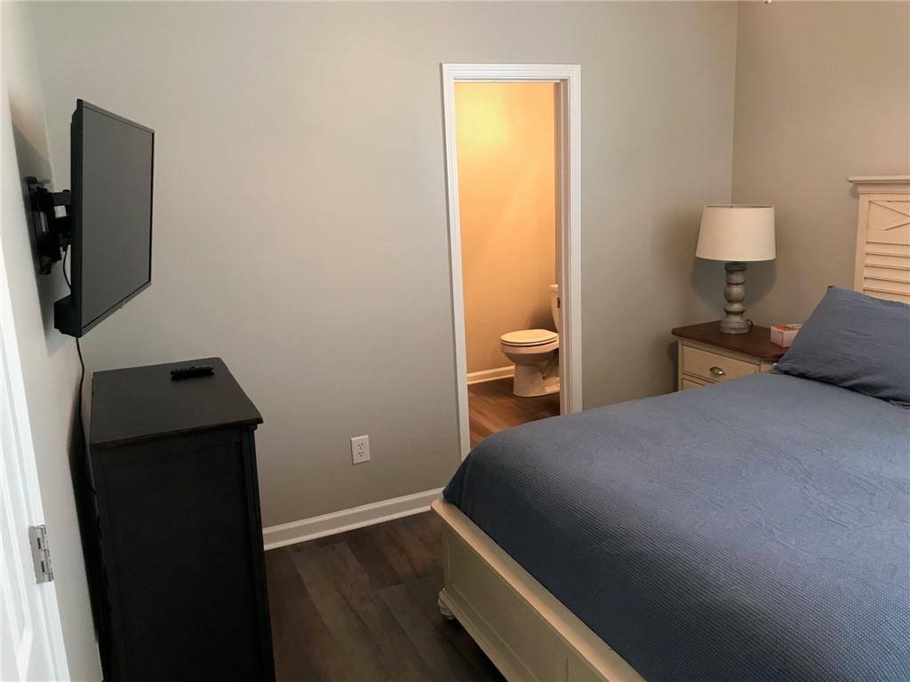 322 Hidden Creek Lane Canton, GA 30114 - Photo 27 of 44 a bedroom with a bed and teddy bear on it