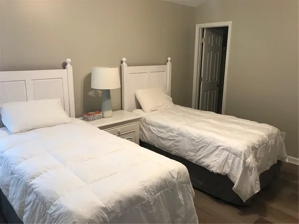 a bedroom with a bed and a toilet