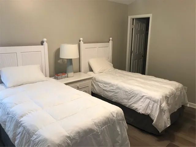 a bedroom with a bed and a toilet