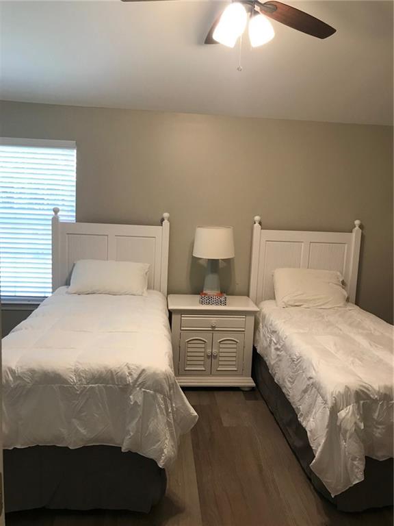 322 Hidden Creek Lane Canton, GA 30114 - Photo 33 of 44 a bedroom with a bed and a night stand