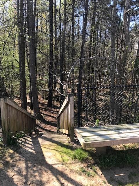 322 Hidden Creek Lane Canton, GA 30114 - Photo 41 of 44 a view of a house with backyard and sitting area