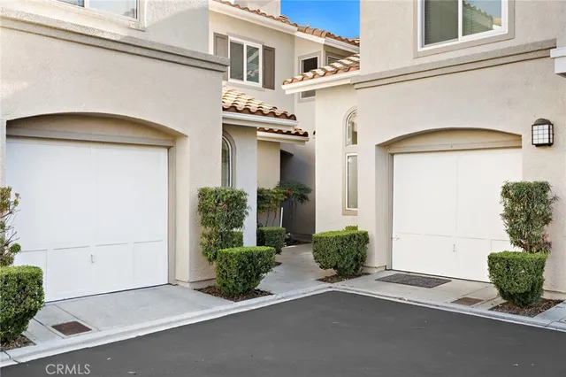 a front view of a house with a garage