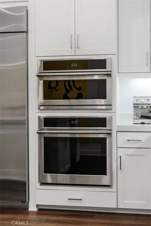 a bedroom with a bed and a lamp