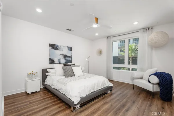 a bedroom with a bed and a hallway