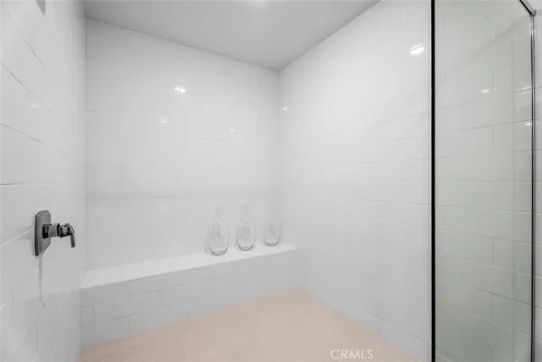 a bathroom with a mirror and a shower