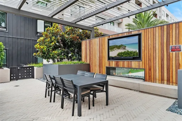 a view of a patio with a table and chairs