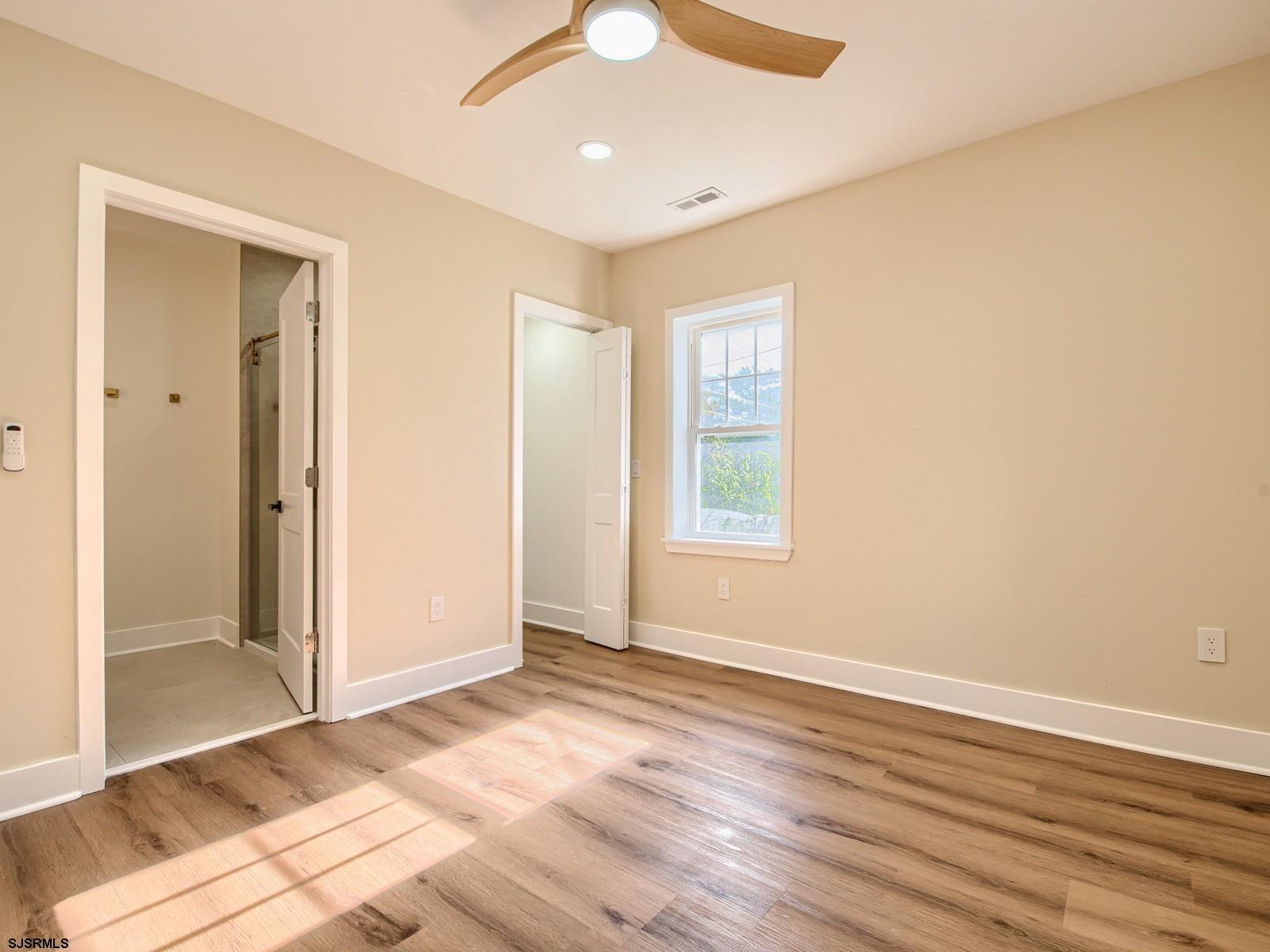 706 Augustine Road Atlantic City, NJ 08401 - Photo 17 of 56 wooden floor in an empty room with a window