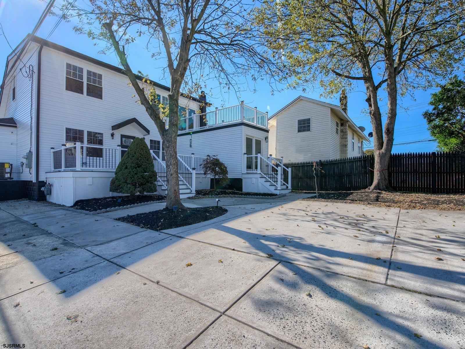 706 Augustine Road Atlantic City, NJ 08401 - Photo 4 of 56 a front view of a house with a yard