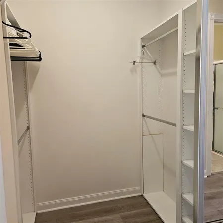 a view of hallway with wooden floor
