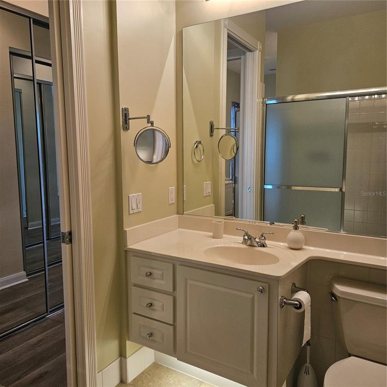 13415 Coluccio Street Venice, FL 34293 - Photo 14 of 39 a bathroom with a sink vanity granite toilet and shower
